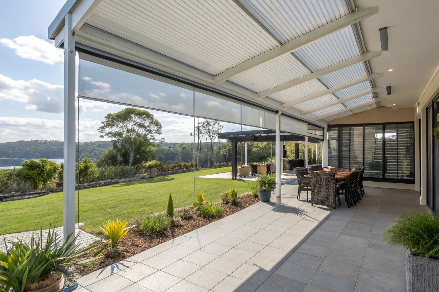 Clear cafe blinds installed on Sunshine Coast patio providing weather protection for outdoor entertaining area