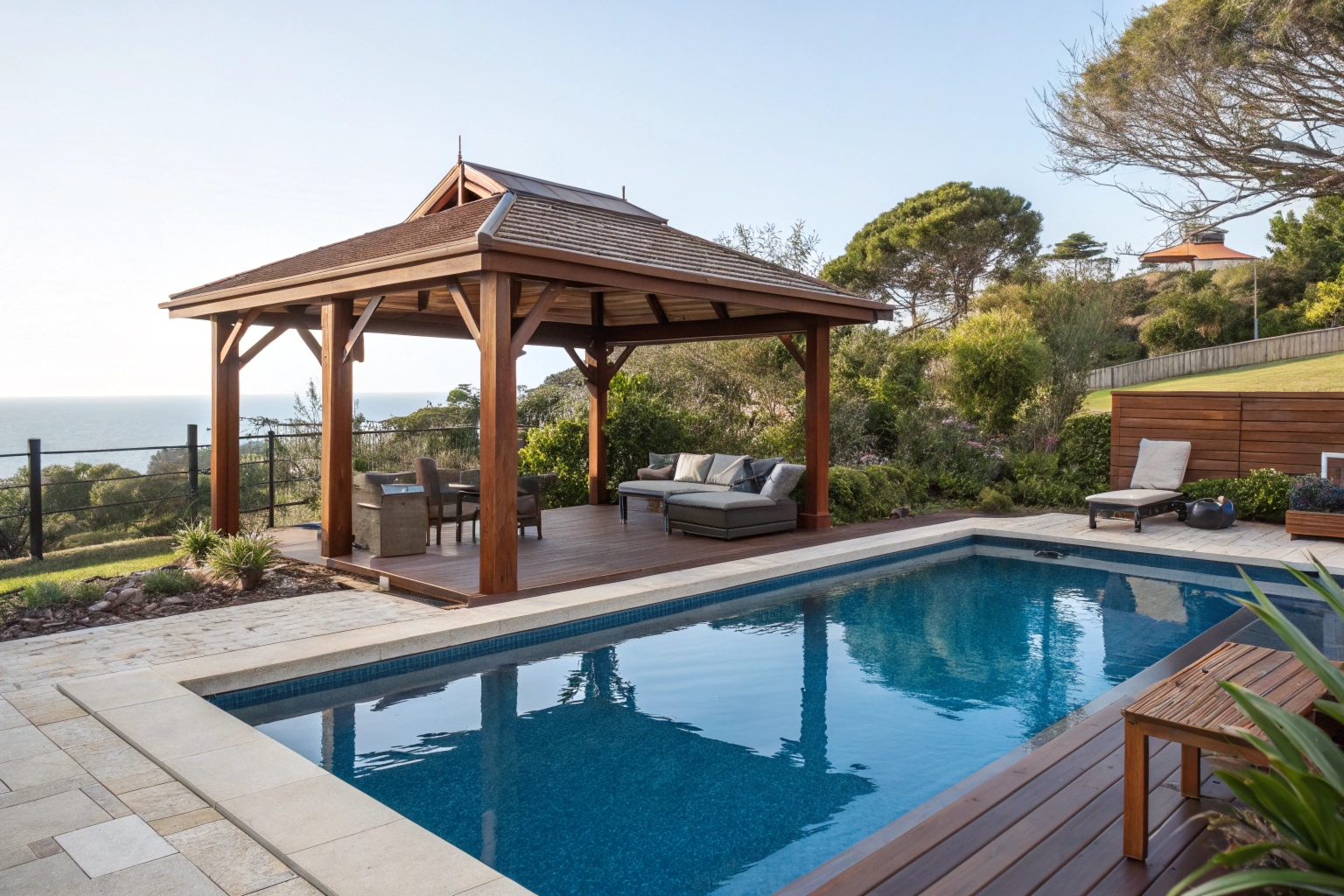 Custom hardwood gazebo next to pool in Sunshine Coast backyard