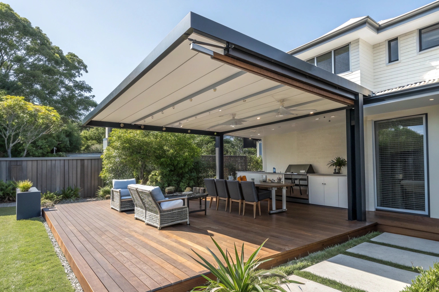 Retractable awning creating comfortable outdoor living space for Sunshine Coast entertaining area